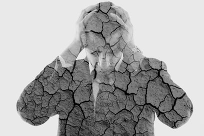 double exposure of depressed business man and dry ground background